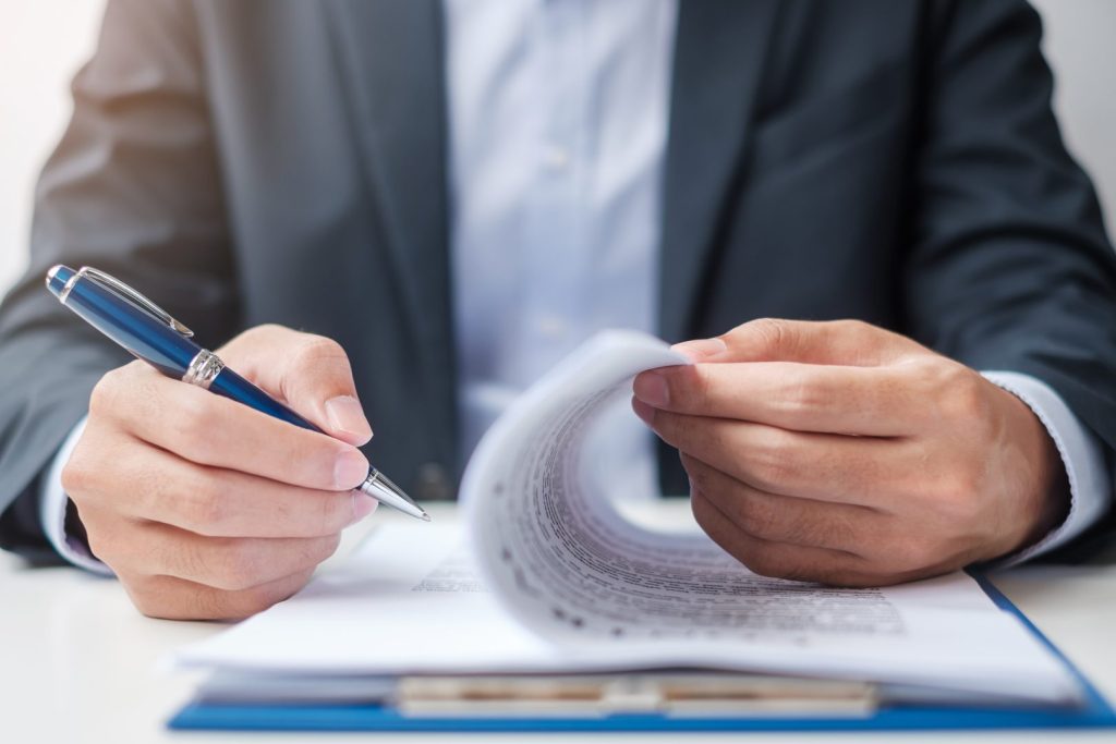 Government official looking at contract documents